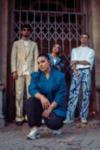 Women and Men Posing in Suits